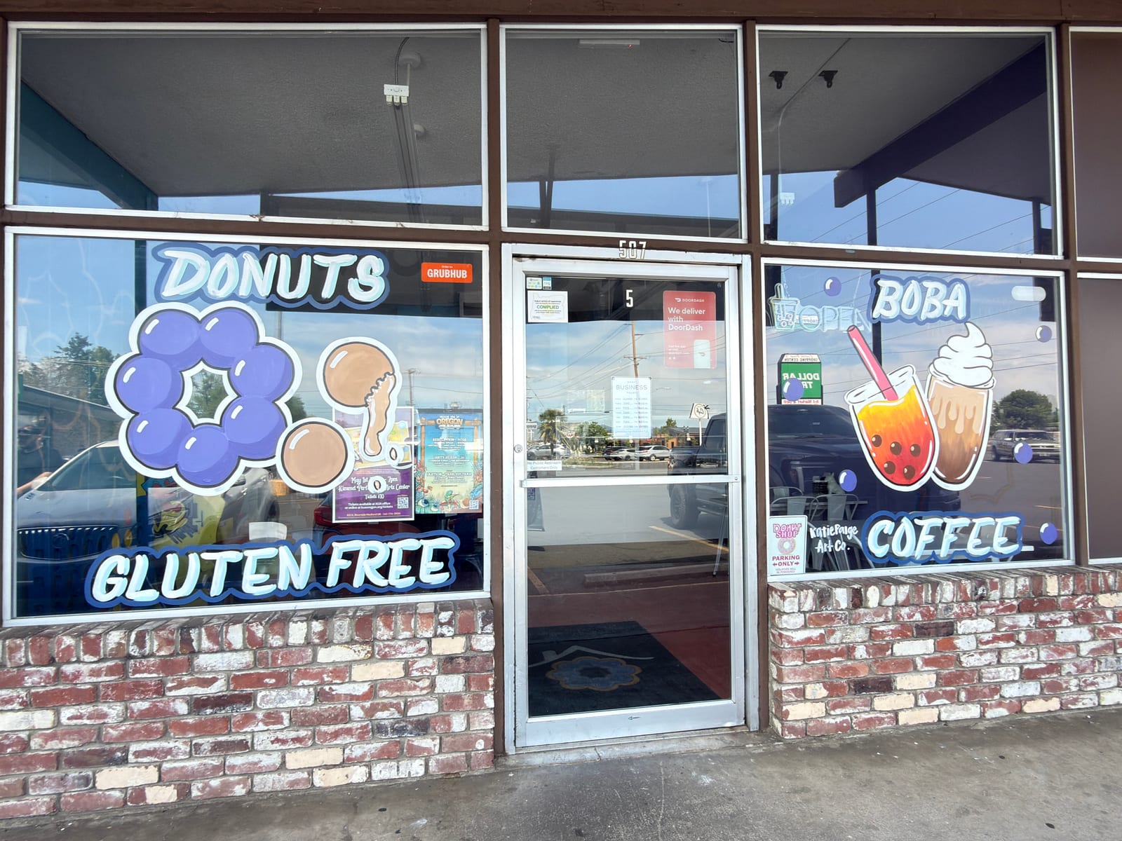 Donuts and boba coffee storefront windows by Katie Paige Art Co