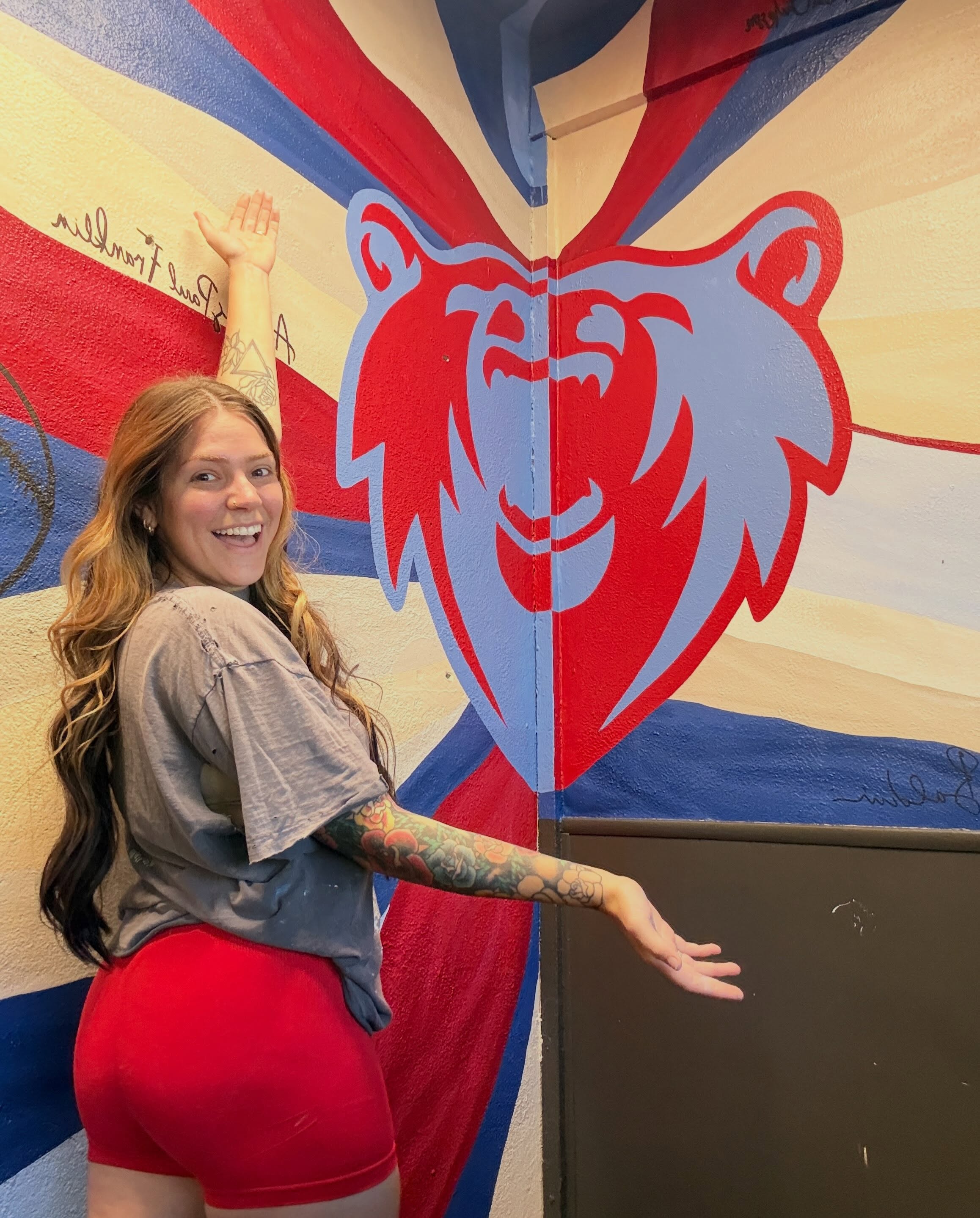 Katie Paige with the Northwest Pizza bear mural in Ashland